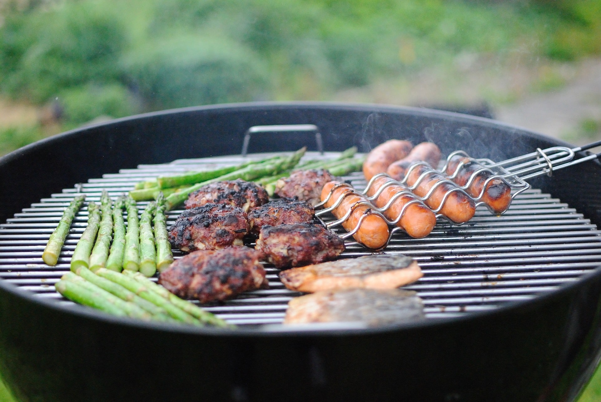 meat and vegetables on charcoal grill