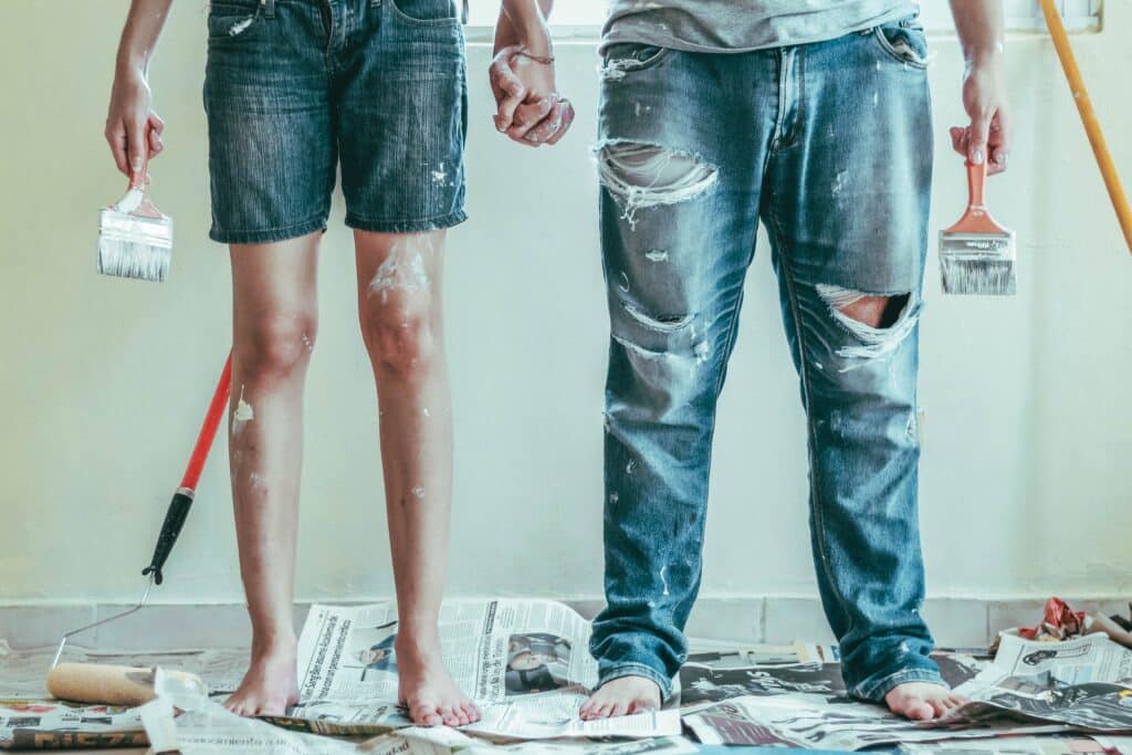 legs of couple covered in paint