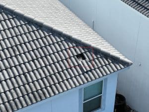 Aerial drone footage of a roof with a slipped tile